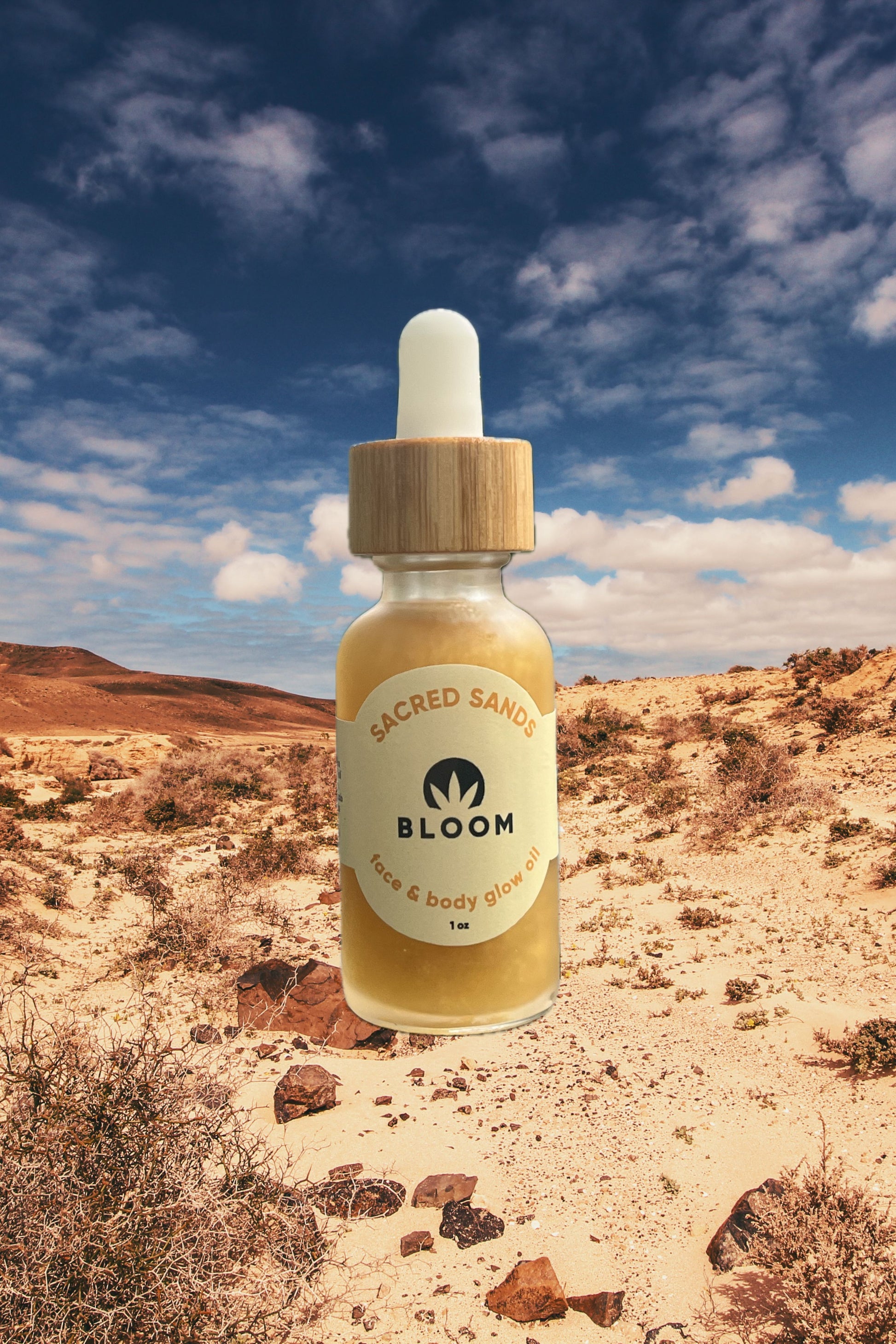 Sacred Sands Glow Oil in roller and 1 oz. dropper forms, featuring a nourishing blend of sea buckthorn oil, hemp extract, and citrus oils for a luminous, sun-kissed glow.