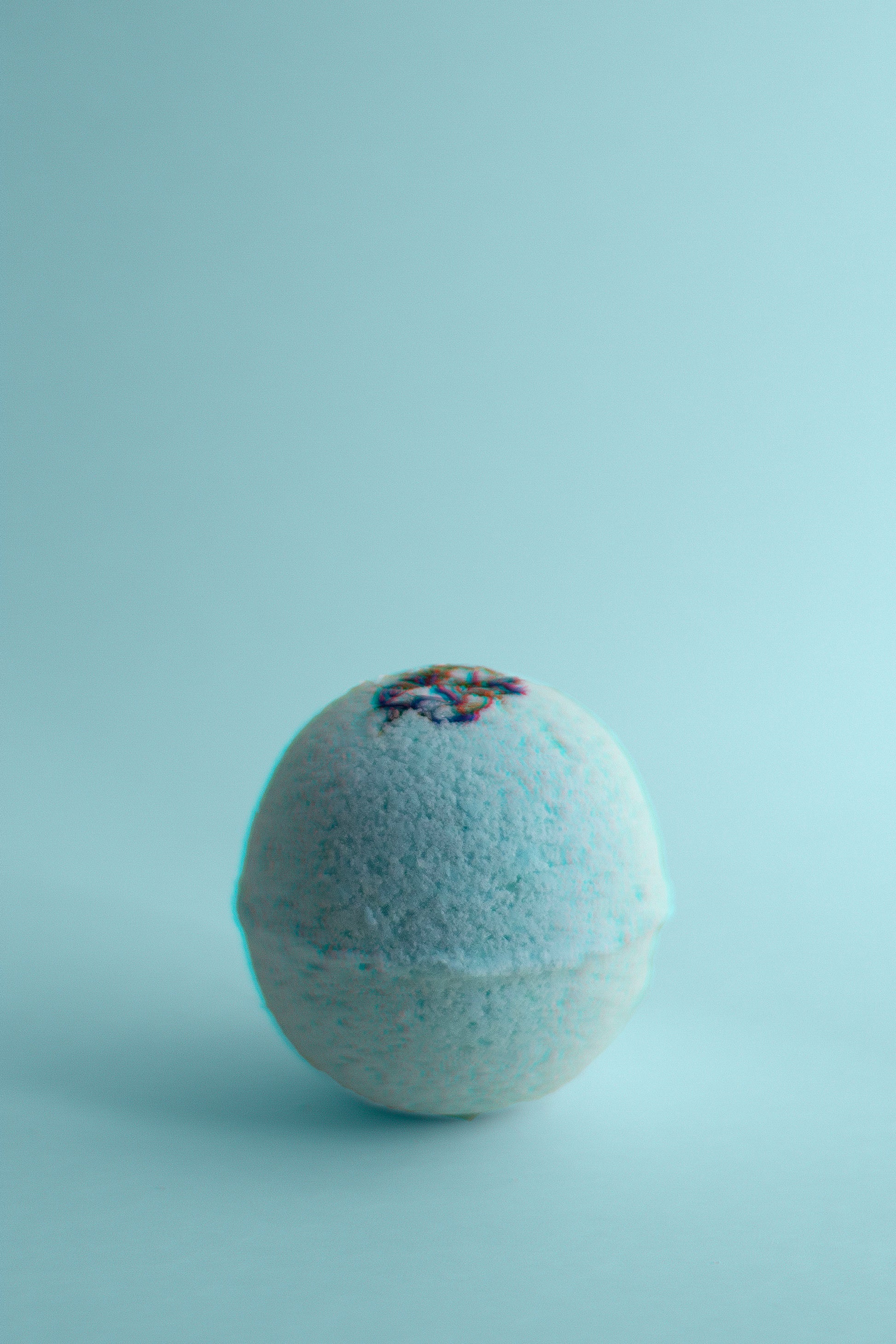 Lavender, peppermint, and cedarwood essential oils bath bomb for restful sleep.