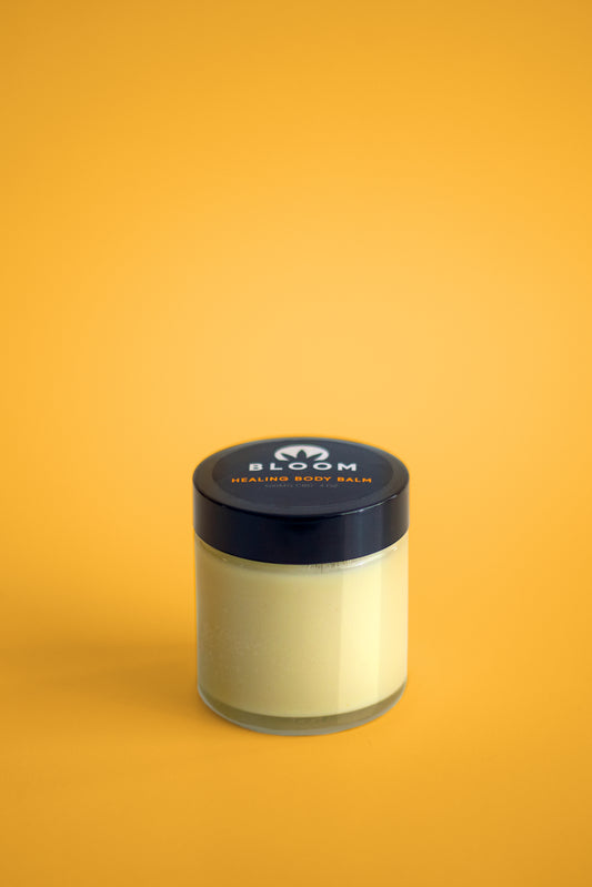 Healing Body Balm with palo santo, carrot seed oil, and mint for deep skin nourishment, pain relief, and mood enhancement. A therapeutic balm for daily self-care.