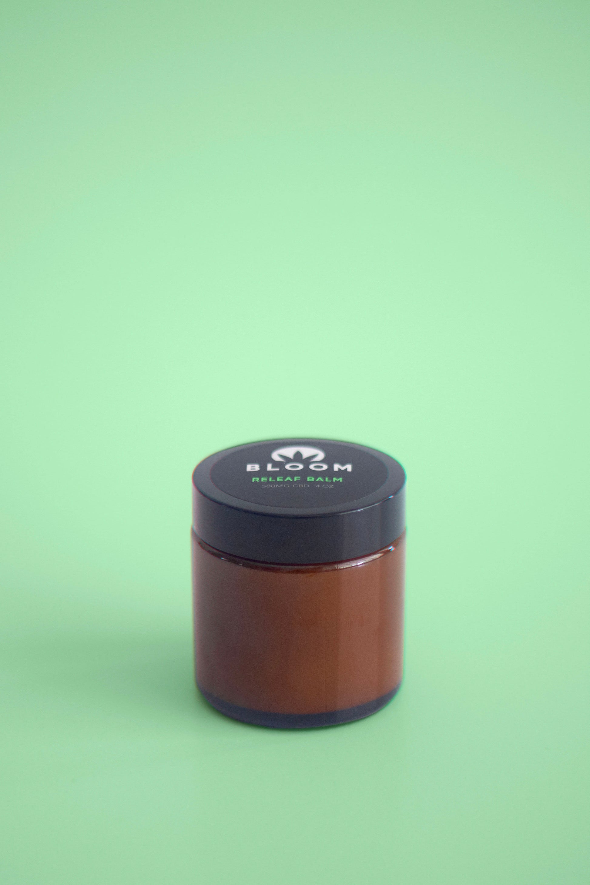 Releaf Balm with peppermint, eucalyptus, and camphor essential oils for extra strength pain relief from headaches, muscle soreness, and menstrual cramps.