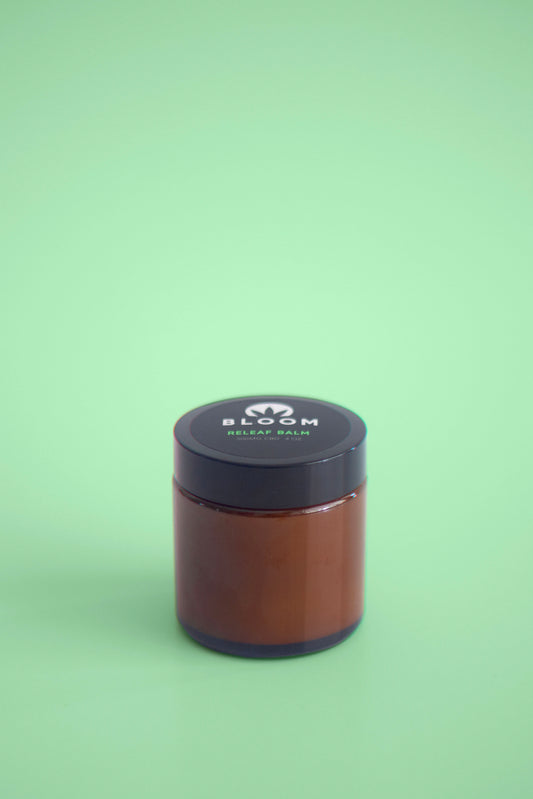 Releaf Balm with peppermint, eucalyptus, and camphor essential oils for extra strength pain relief from headaches, muscle soreness, and menstrual cramps.